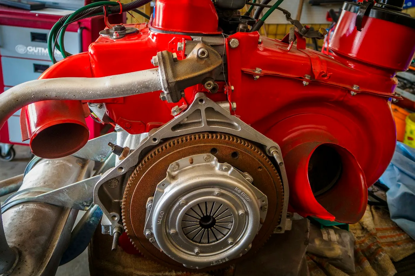 Mechanic inspecting a modern engine in a workshop