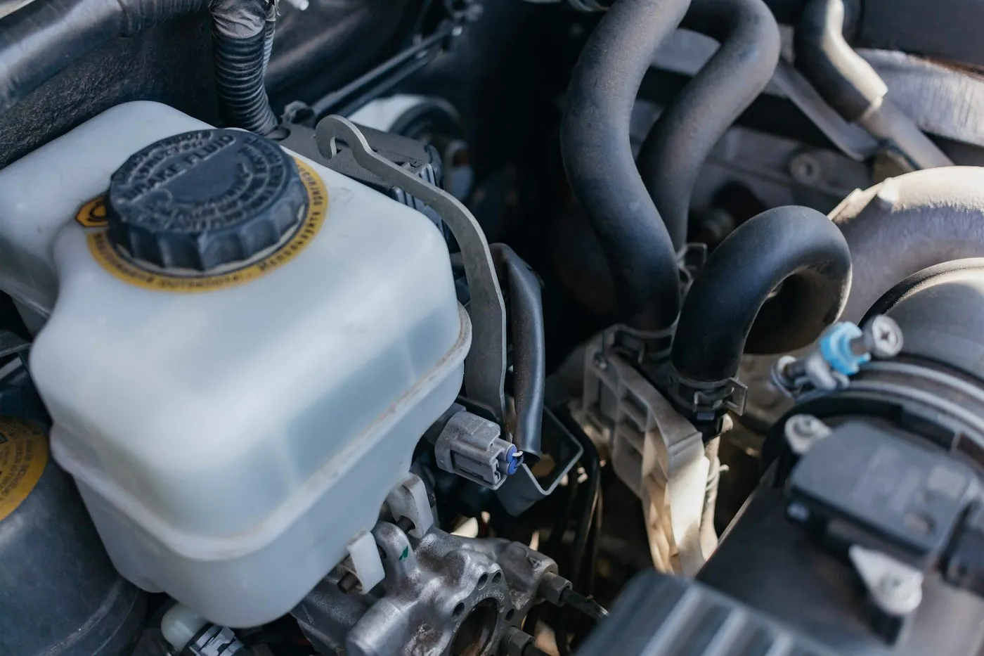 Engine oil being poured into an engine compartment